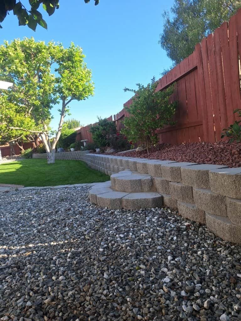 Retaining wall and garden landscape with trees in Paradise Valley.